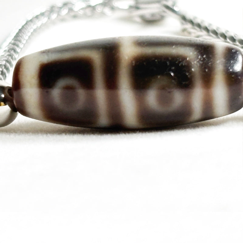Four Eye Dzi Bead Bracelet
